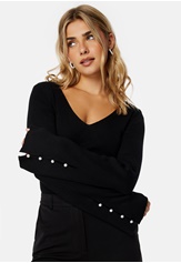 carlie-pearl-button-top-black